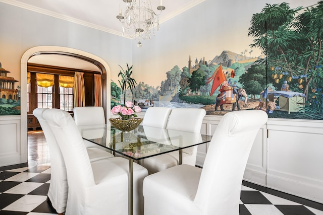 1320 N State Pkwy Unit 14-15Cd, Chicago, IL 60610 - dining space with tile patterned floors, a chandelier, a wainscoted wall, ornamental molding, and a decorative wall