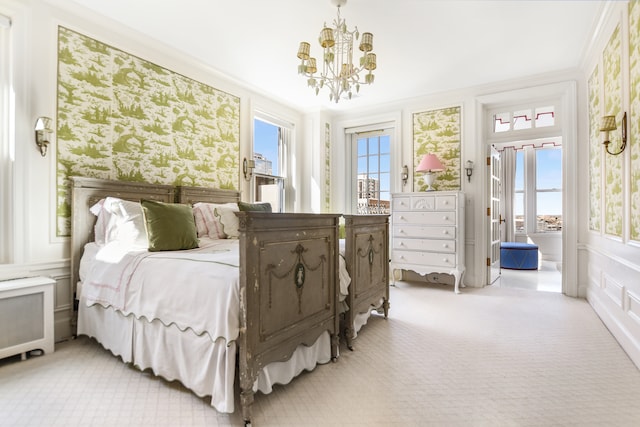 carpeted bedroom with radiator heating unit, ornamental molding, multiple windows, and an inviting chandelier