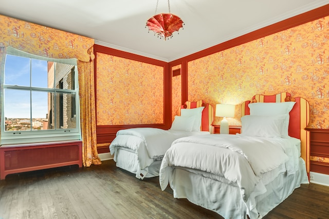 bedroom featuring crown molding and dark hardwood / wood-style flooring