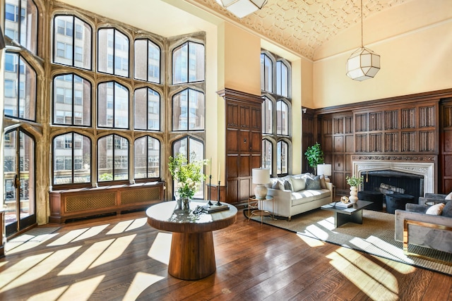 1320 N State Pkwy Unit 14-15Cd, Chicago, IL 60610 - living room with high vaulted ceiling, hardwood / wood-style flooring, and a fireplace