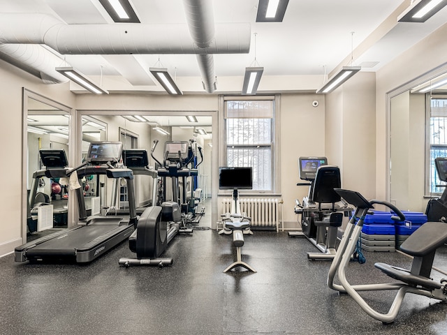 exercise room featuring radiator