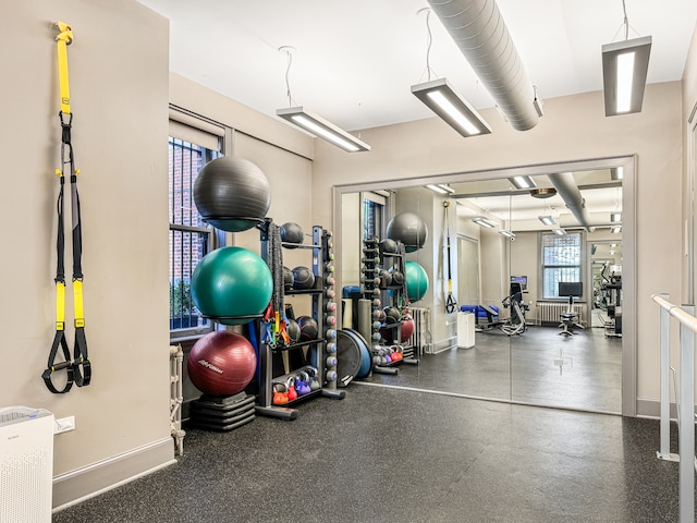 gym featuring a wealth of natural light