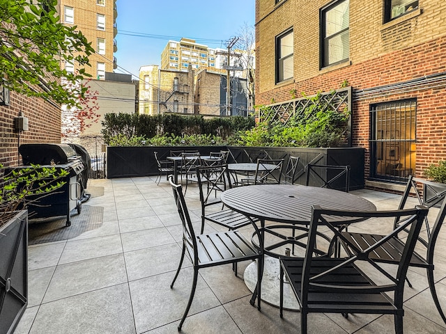 view of patio featuring a grill