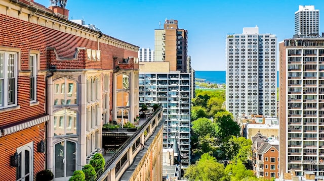 property's view of city featuring a water view