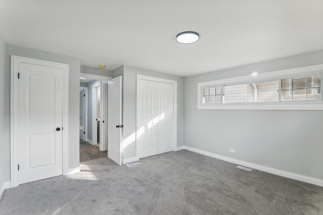 unfurnished bedroom with carpet floors