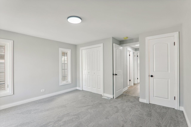 unfurnished bedroom with light carpet