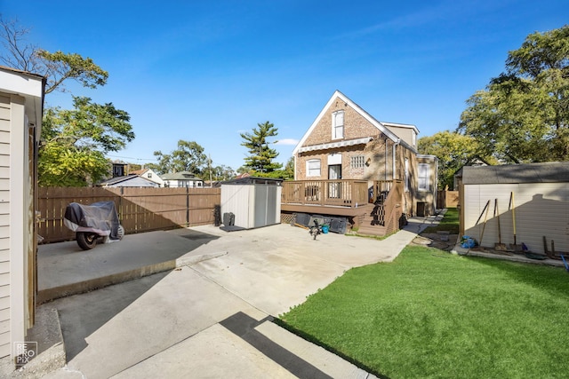 exterior space featuring a patio area and a shed