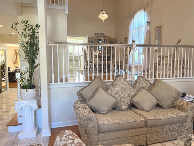 living room with a towering ceiling