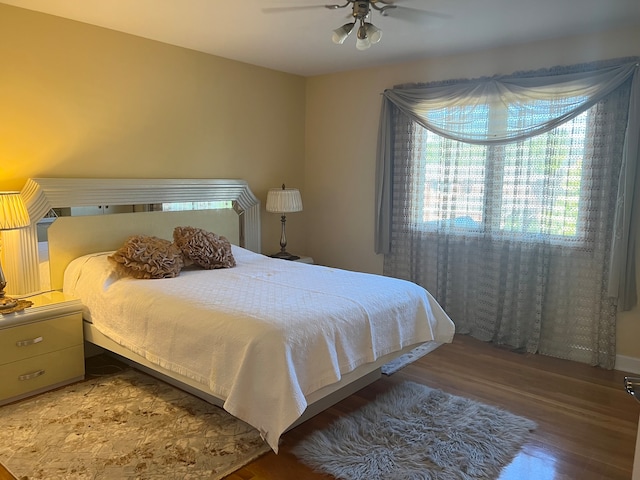 bedroom featuring ceiling fan and wood-type flooring