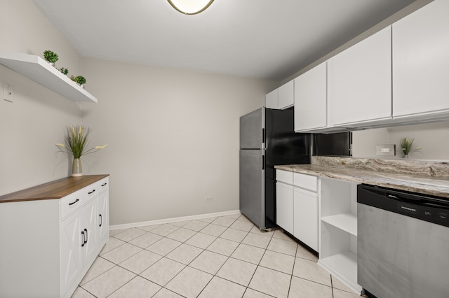 kitchen featuring white cabinetry, stainless steel appliances, and light tile patterned floors