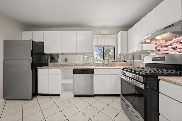 kitchen featuring white cabinetry, light tile patterned floors, appliances with stainless steel finishes, and sink