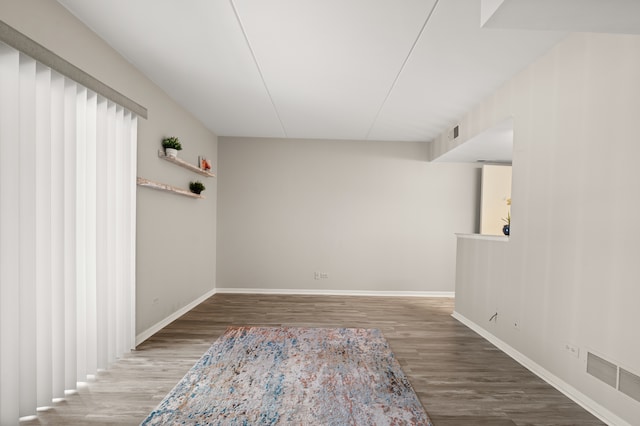 unfurnished room with hardwood / wood-style floors