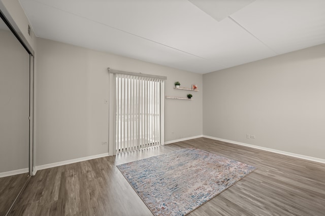 spare room featuring dark hardwood / wood-style floors