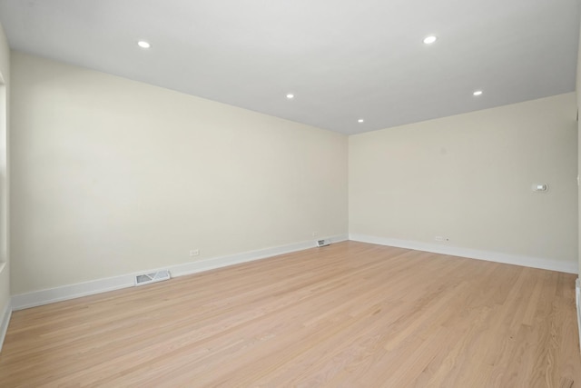 spare room featuring light hardwood / wood-style flooring