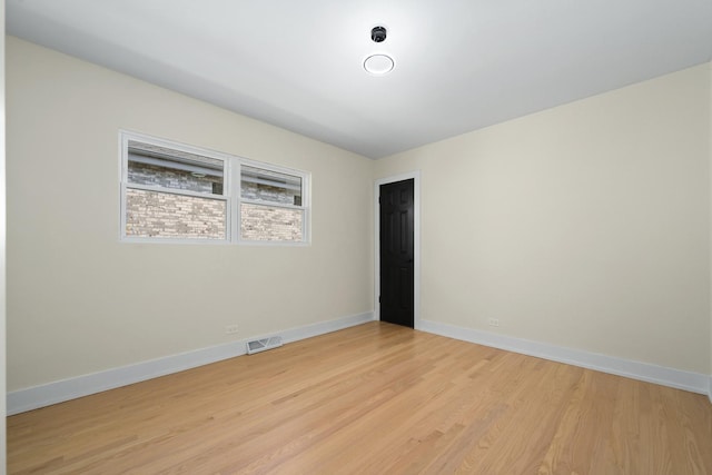 unfurnished room featuring light wood-type flooring