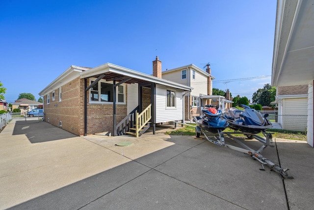 rear view of property featuring a patio