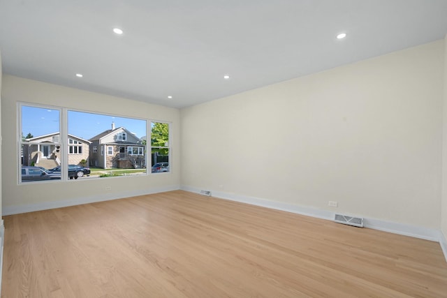 unfurnished room featuring light hardwood / wood-style floors