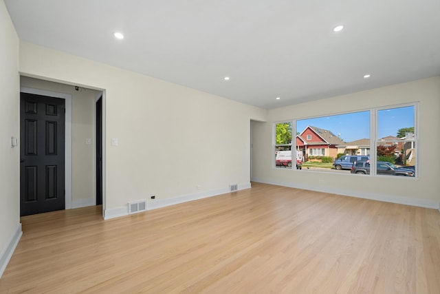 spare room with light wood-type flooring