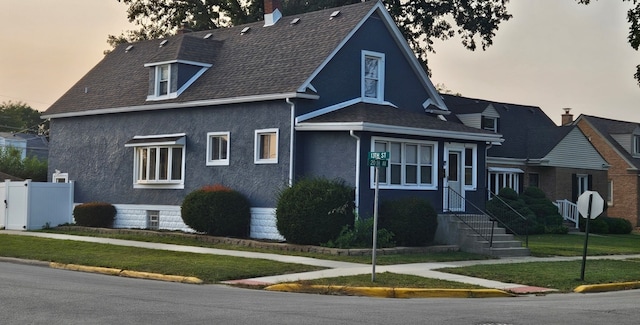 view of front of home with a yard