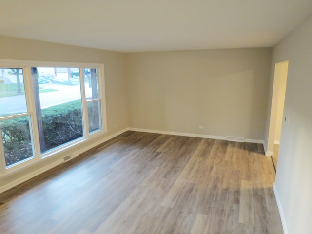 empty room with light hardwood / wood-style floors