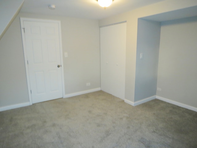 unfurnished bedroom featuring light carpet