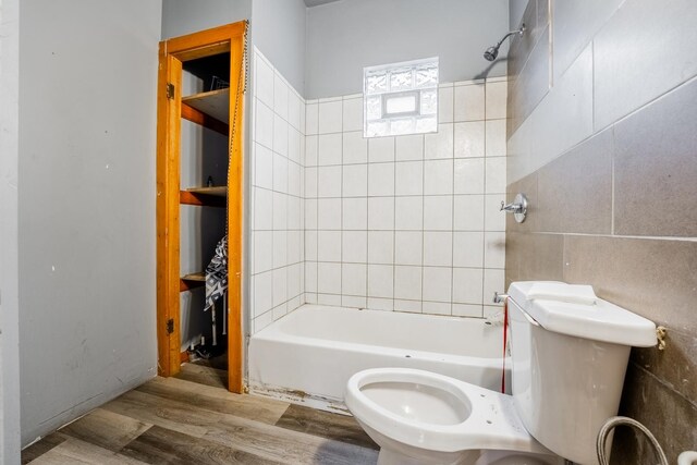 5338 S Wood St, Chicago, IL 60609 - full bathroom with wood finished floors, shower / bathtub combination, and tile walls