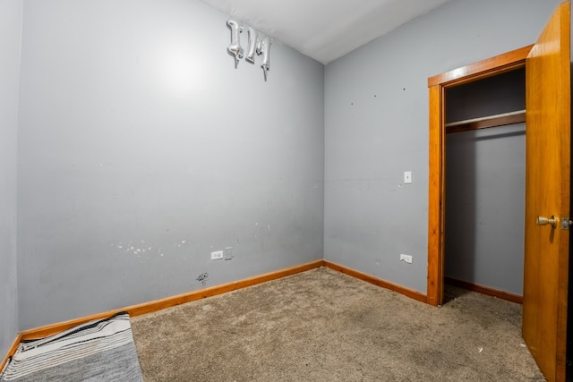 unfurnished bedroom with a closet and carpet