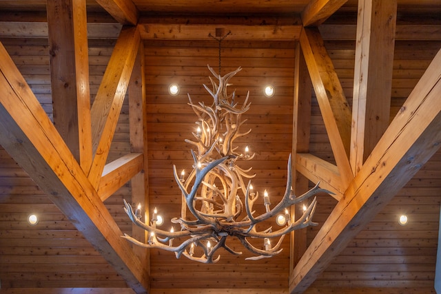 room details with wooden ceiling, beamed ceiling, and a chandelier