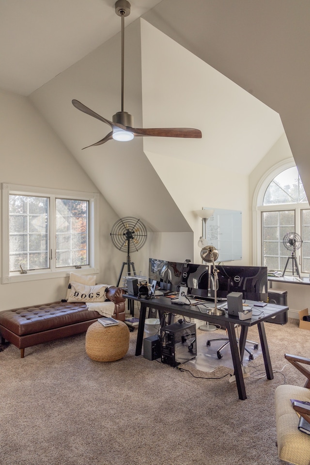 carpeted living room with high vaulted ceiling and ceiling fan