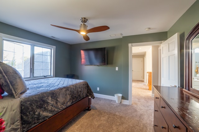 bedroom with light carpet and ceiling fan