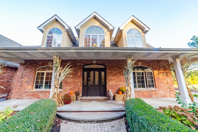 property entrance featuring covered porch