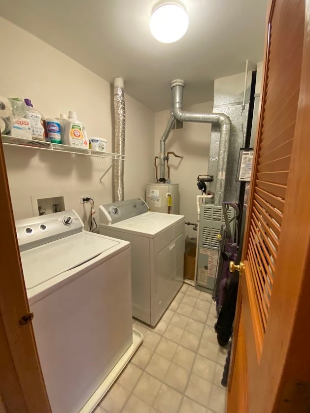 clothes washing area featuring separate washer and dryer