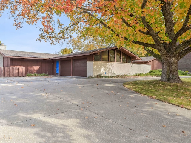 ranch-style home with a garage