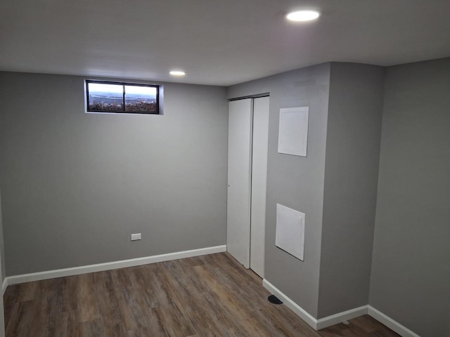 below grade area featuring recessed lighting, baseboards, and wood finished floors