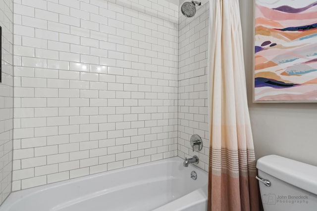 bathroom with shower / bath combo with shower curtain