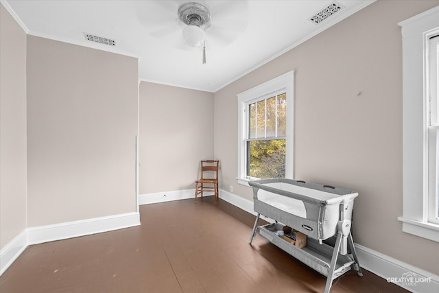 miscellaneous room with ornamental molding, dark hardwood / wood-style flooring, and ceiling fan