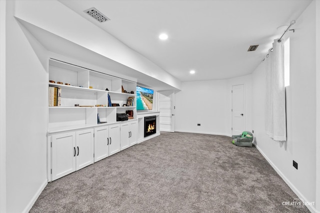 unfurnished living room featuring carpet flooring