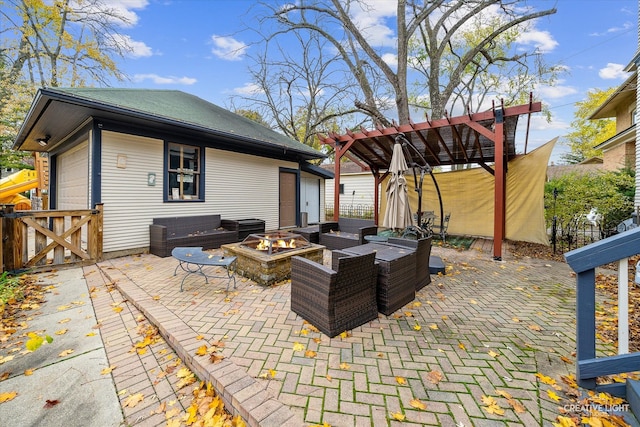 view of patio with an outdoor living space with a fire pit and a pergola