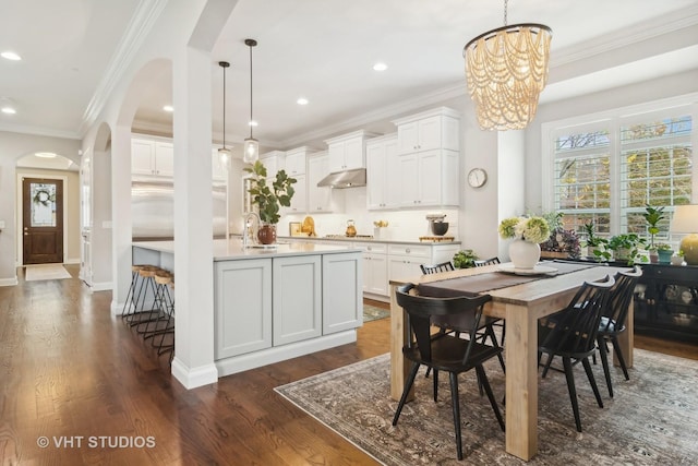 kitchen with decorative light fixtures and white cabinets