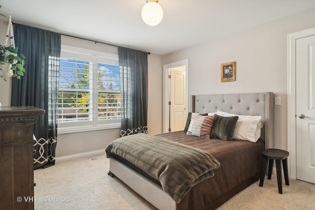 bedroom with light colored carpet