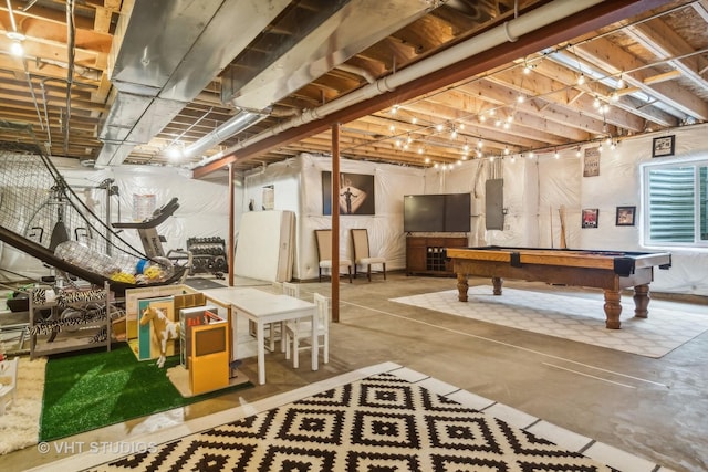 basement with pool table and electric panel