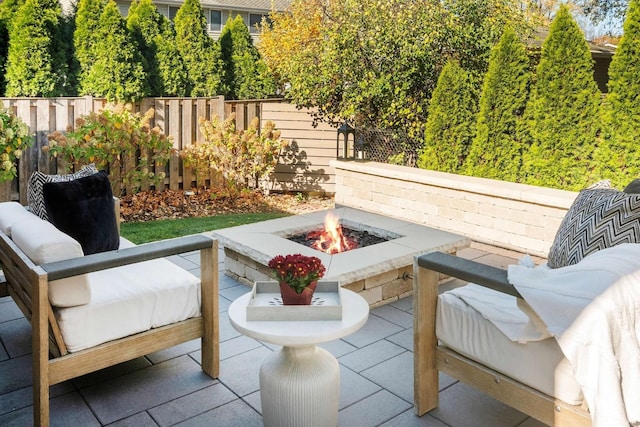 view of patio with an outdoor fire pit