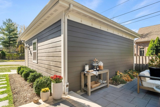 view of side of property with a patio