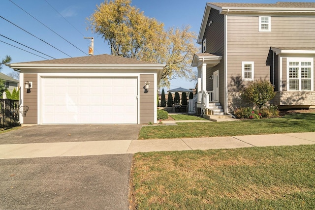 view of front of home featuring a garage and a front yard