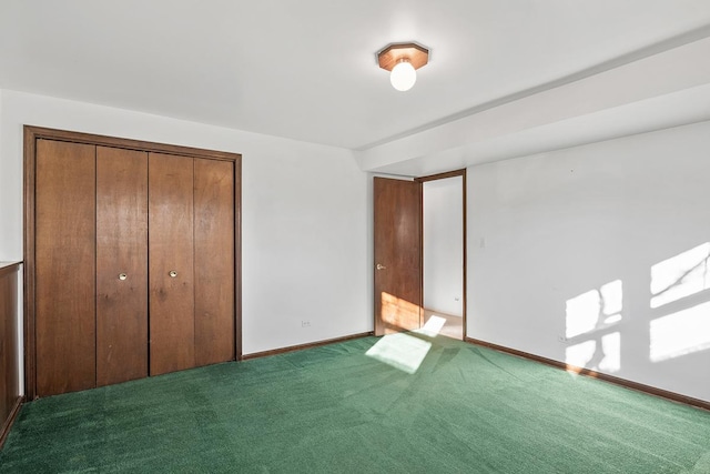 unfurnished bedroom with carpet flooring and a closet