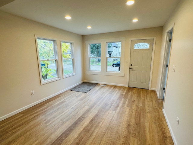 foyer entrance with light hardwood / wood-style floors