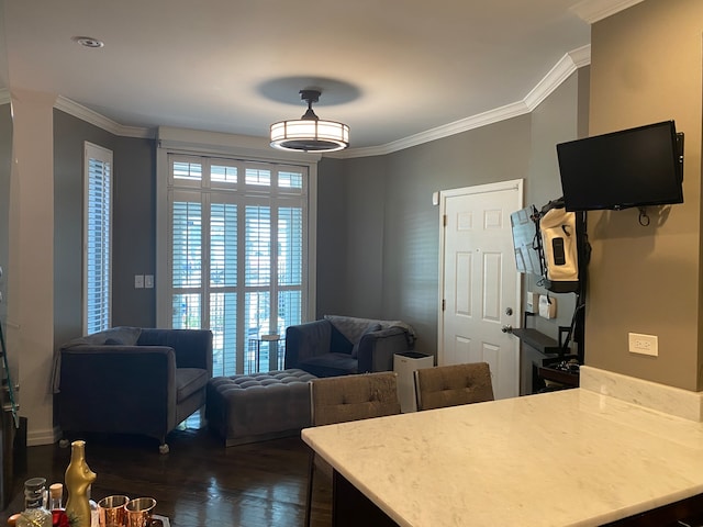 kitchen featuring crown molding and dark hardwood / wood-style flooring