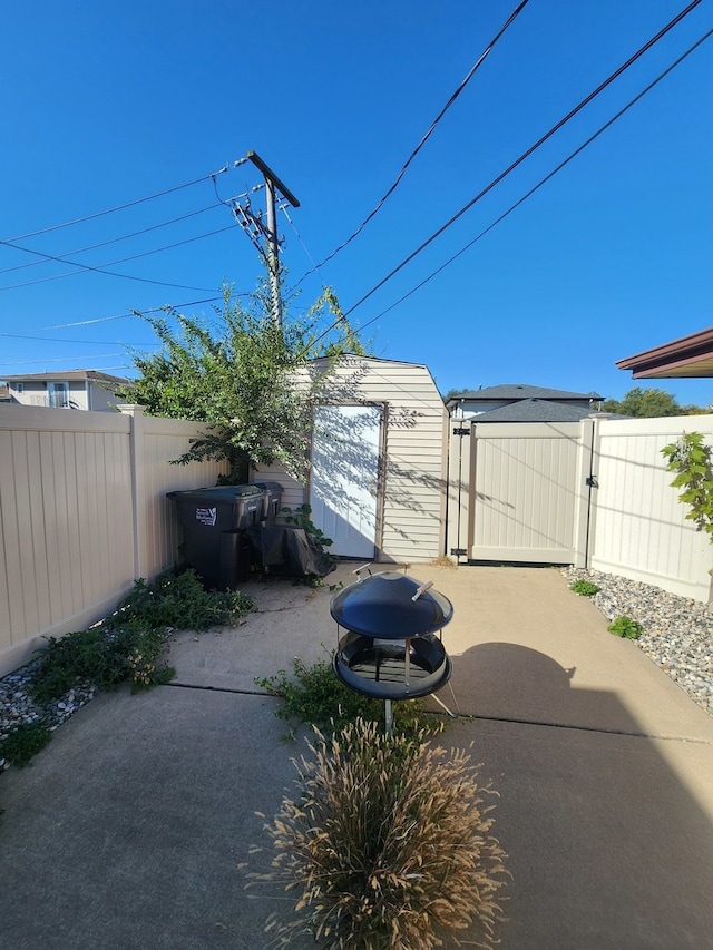 view of patio featuring a storage shed