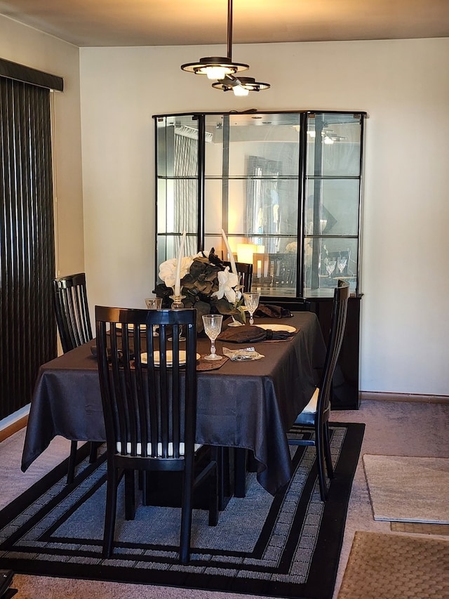 dining space featuring carpet flooring