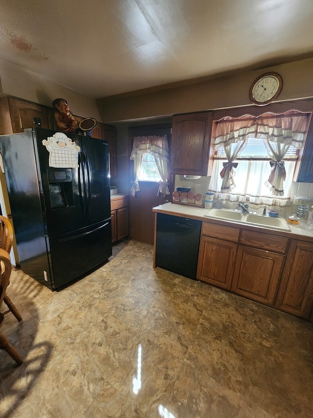 kitchen featuring black appliances and sink